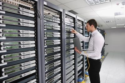 Business man engineer in data center server room